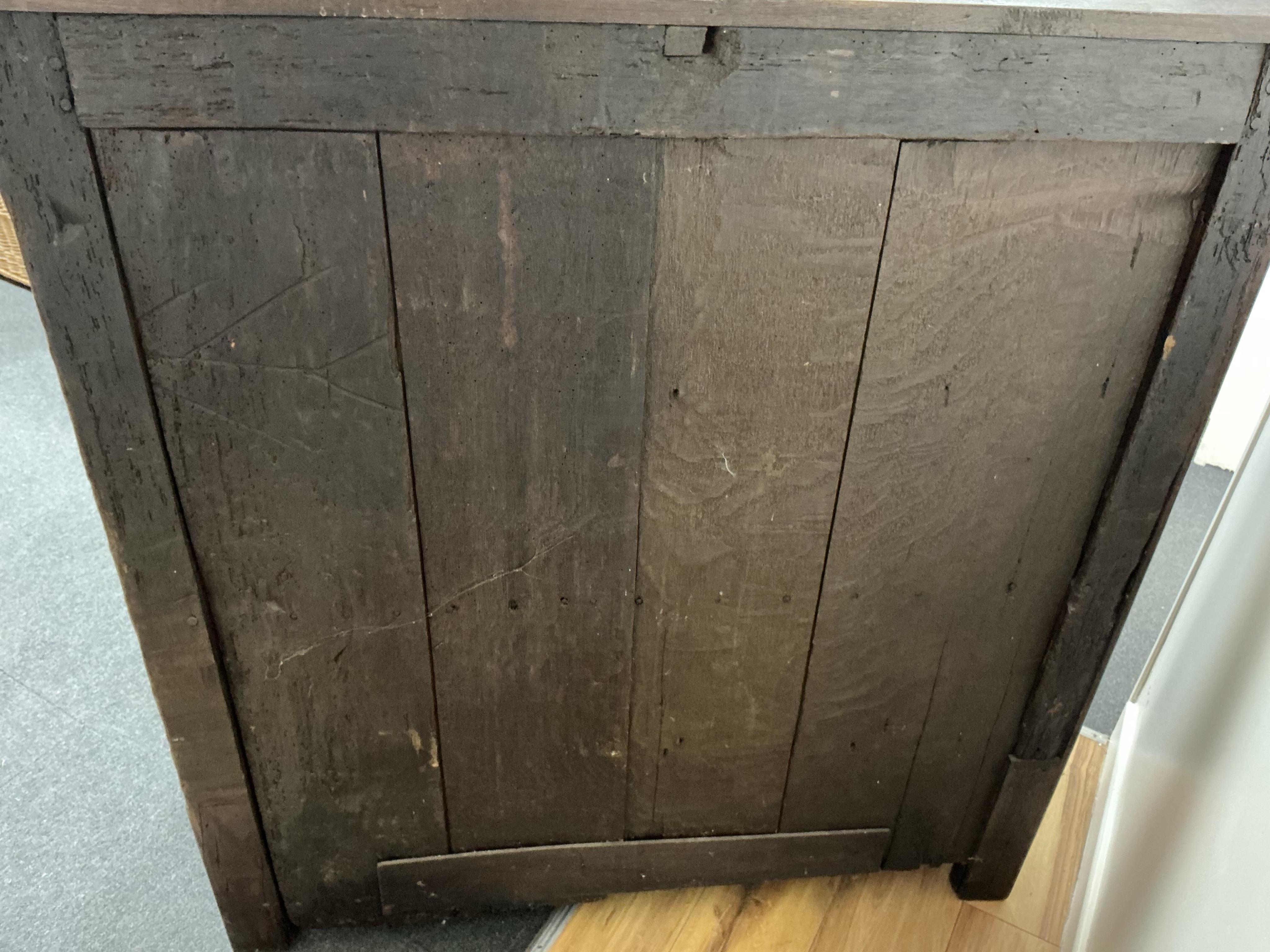 An 18th century and later French carved oak two door cabinet, width 115cm, depth 53cm, height 115cm